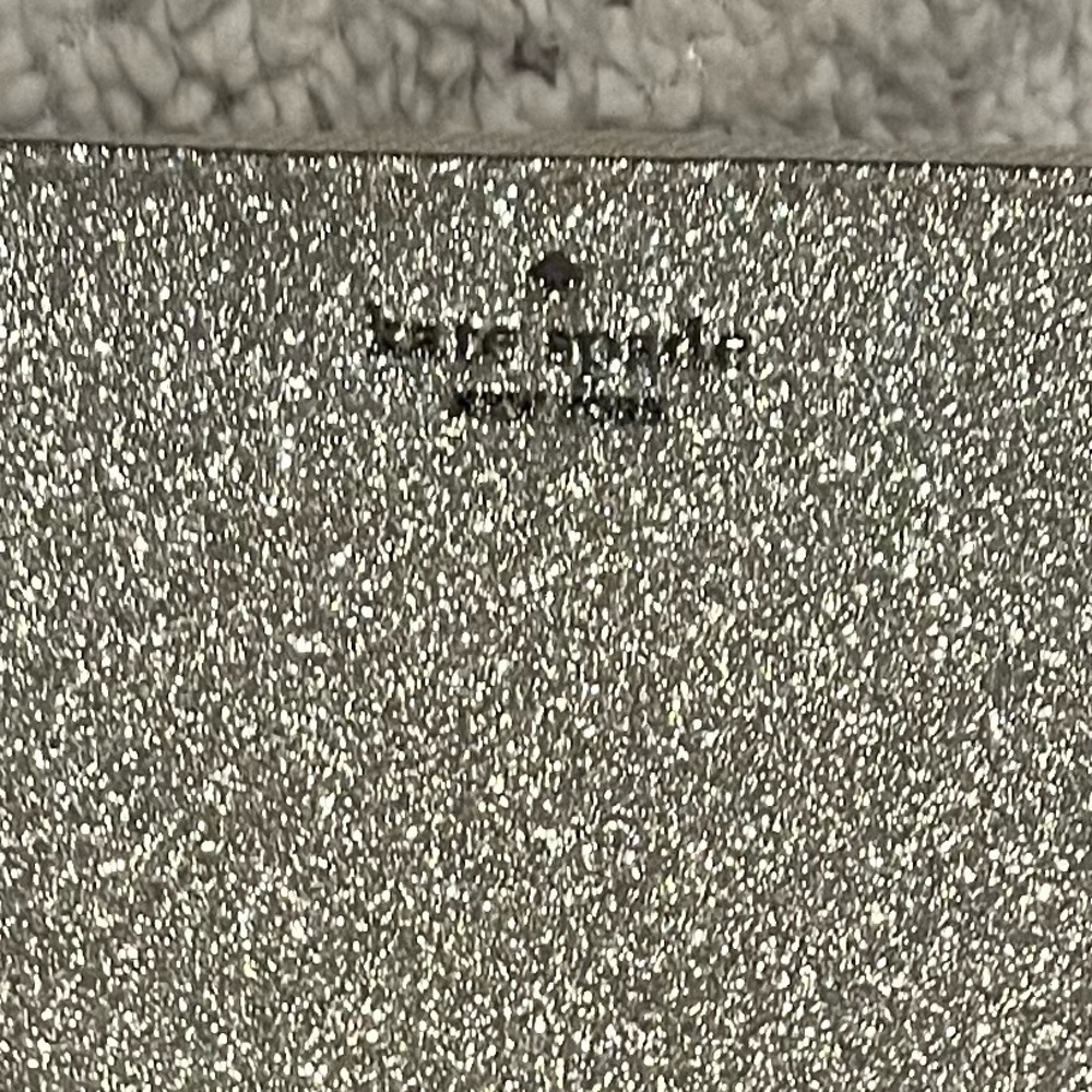Kate Spade long wallet in silver.